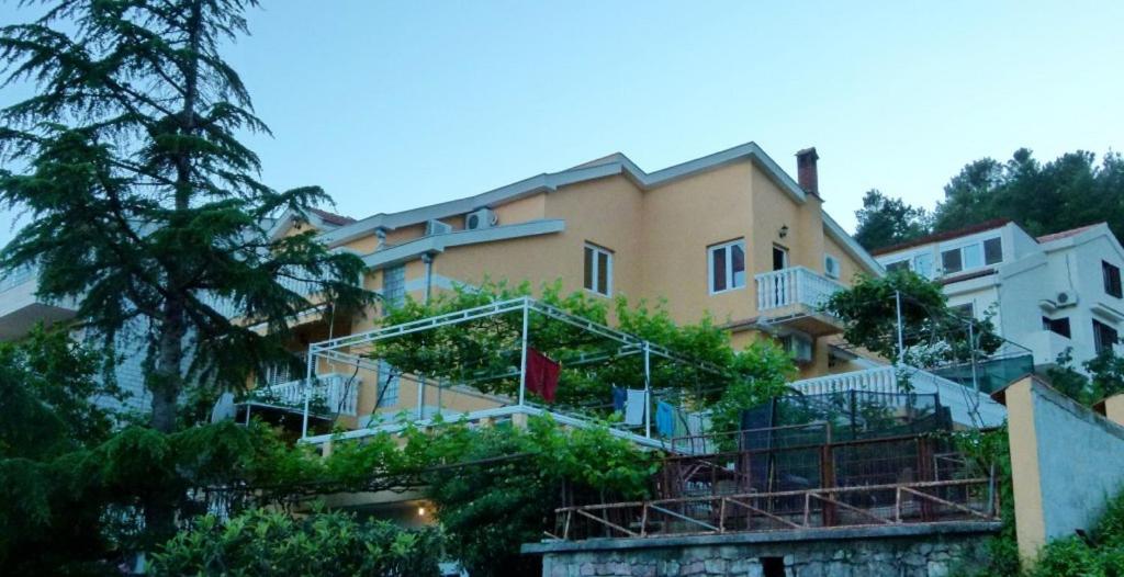 a building with stairs and plants on it at Apartments Antic in Budva