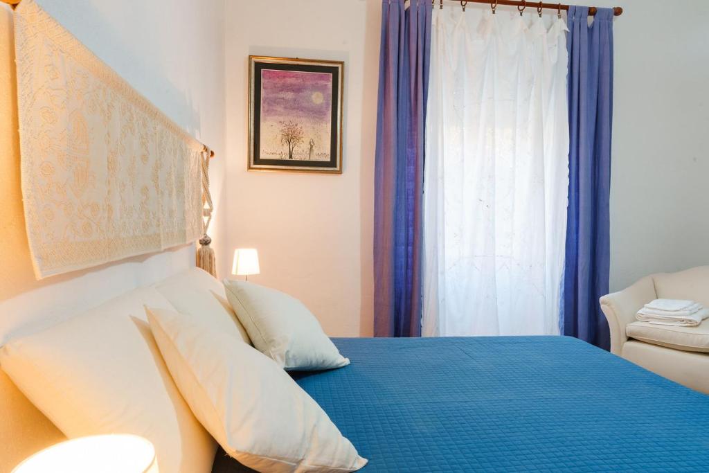 Postel nebo postele na pokoji v ubytování Holiday Home Alle Pavoncelle, indipendente con terrazzo di 60 mq