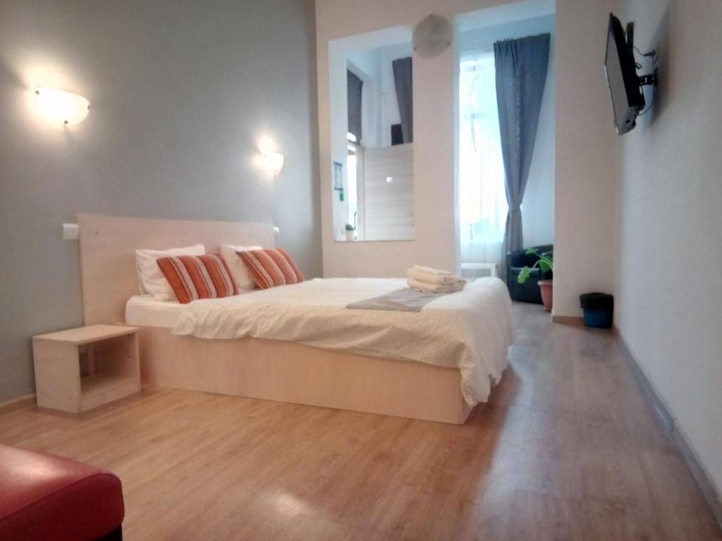Postel nebo postele na pokoji v ubytování Central Guesthouse