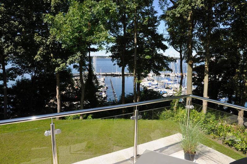 a balcony with a view of a body of water at Villa Bellevue II in Heikendorf