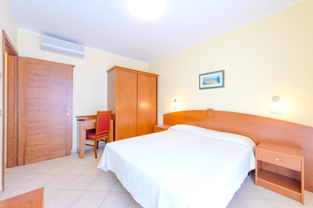 En eller flere senger på et rom på One bedroom appartement with wifi at Rimini