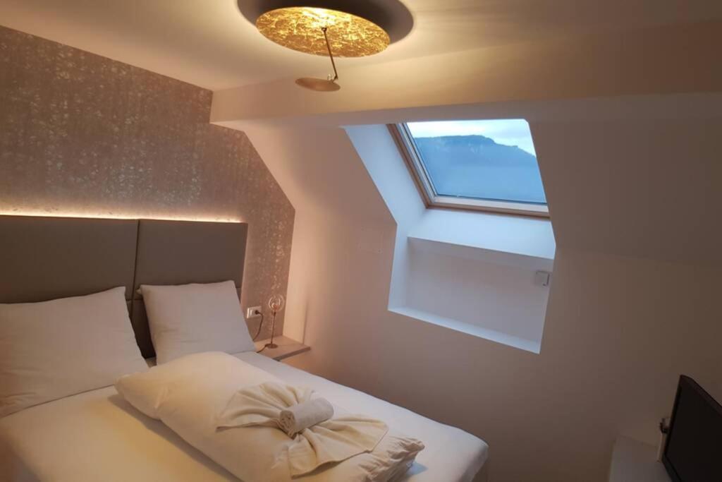 Postel nebo postele na pokoji v ubytování Gardenpark Loft