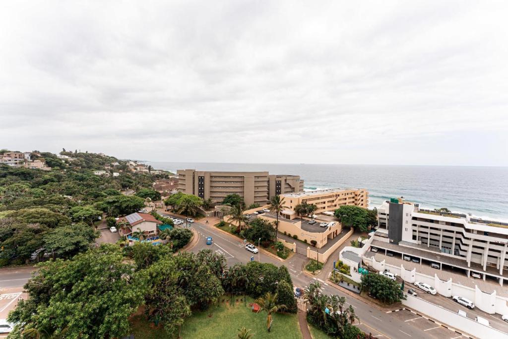 an aerial view of a city and the ocean at Amazing Sea View Apartment La Ballito in Ballito