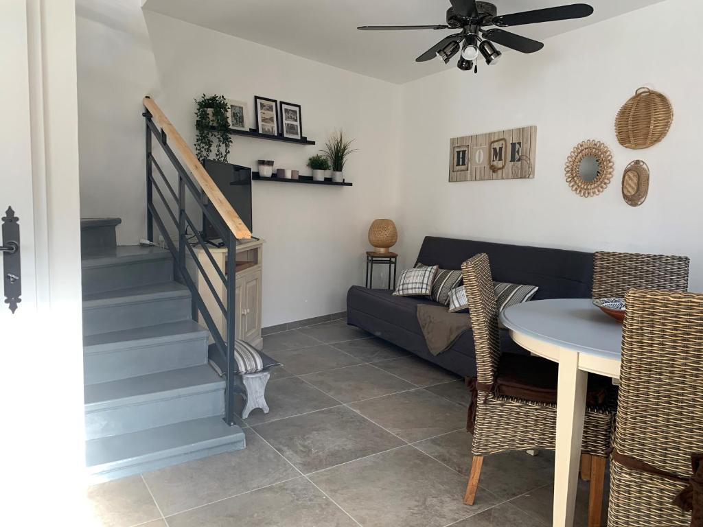 a living room with a couch and a table at Solimany in Saint-Gilles