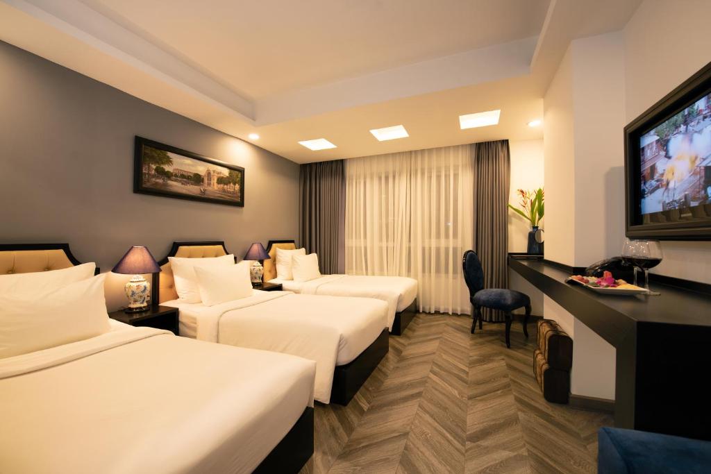TV a/nebo společenská místnost v ubytování Adora Art Hotel