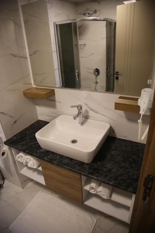 Koupelna v ubytování Golden World Suite Hotel