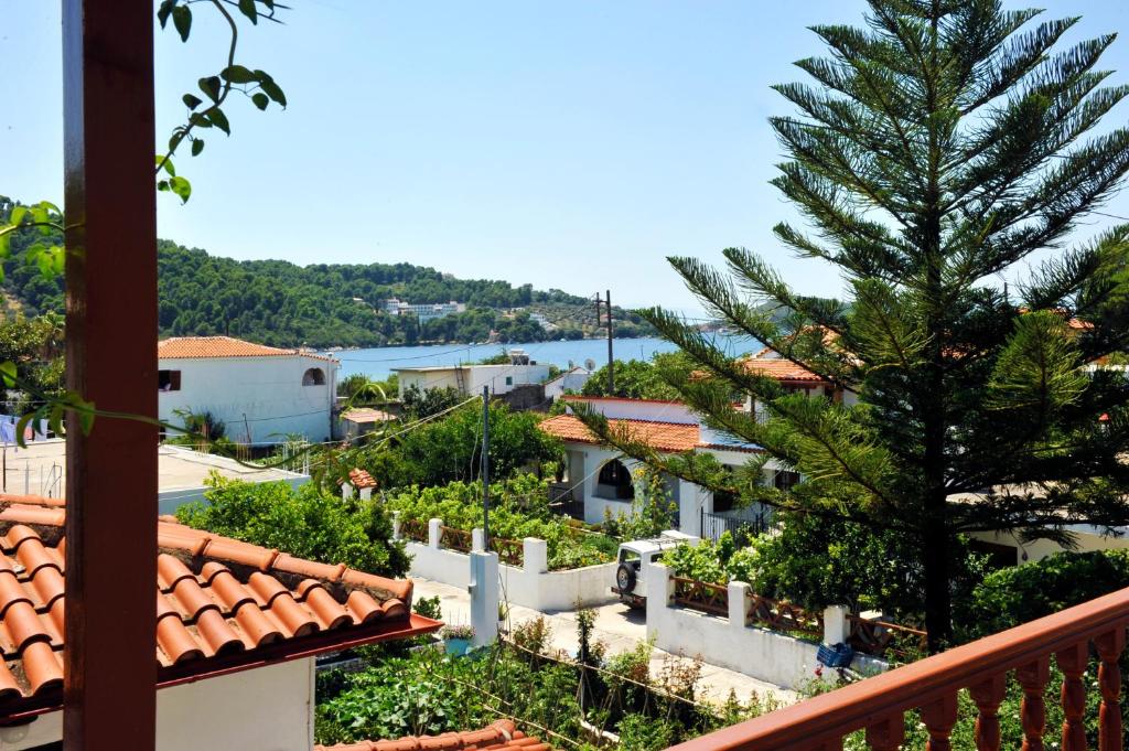 a view of a town from a balcony at Chrissomalli Sofia Studios in Skiathos