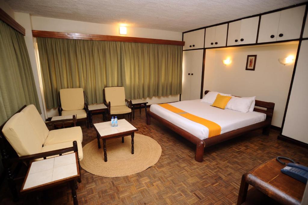 Postel nebo postele na pokoji v ubytování Kenya Comfort Suites