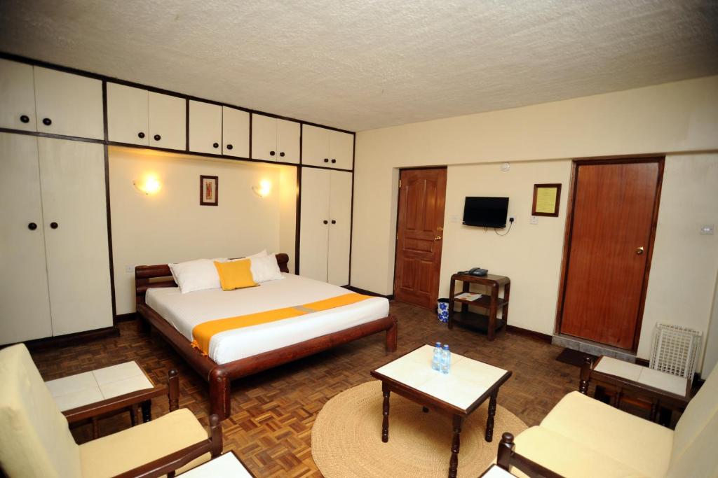 Postel nebo postele na pokoji v ubytování Kenya Comfort Suites