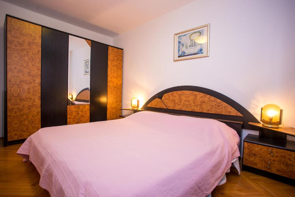Postel nebo postele na pokoji v ubytování Apartman M&M Žminj
