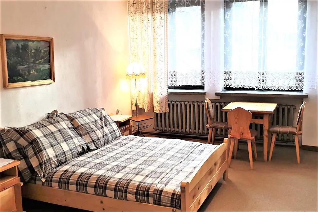 Posteľ alebo postele v izbe v ubytovaní Willa Asta & Domek Pod Tatrami