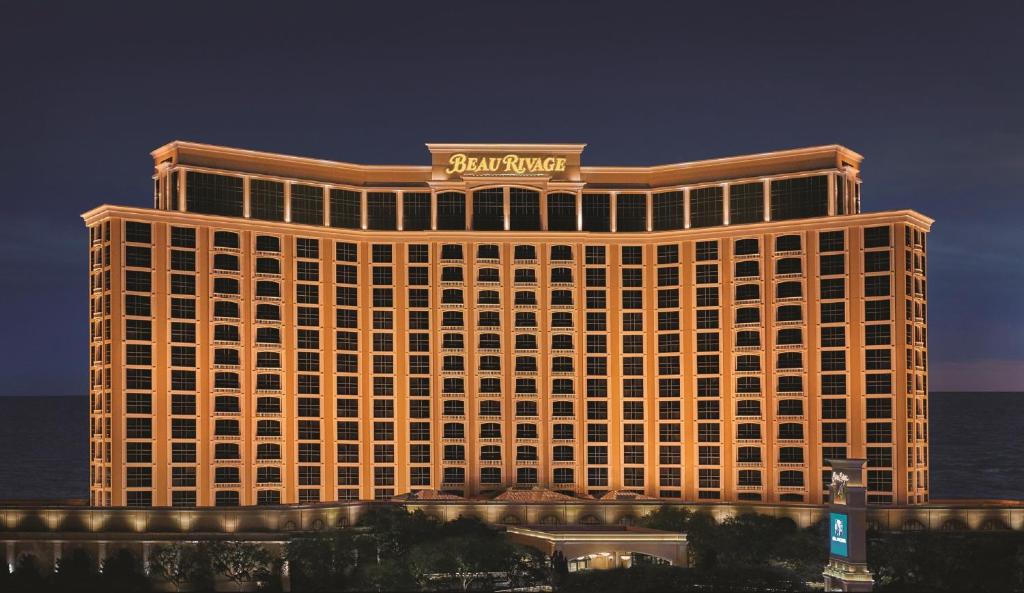 a hotel building with a sign on top of it at Beau Rivage Resort & Casino in Biloxi