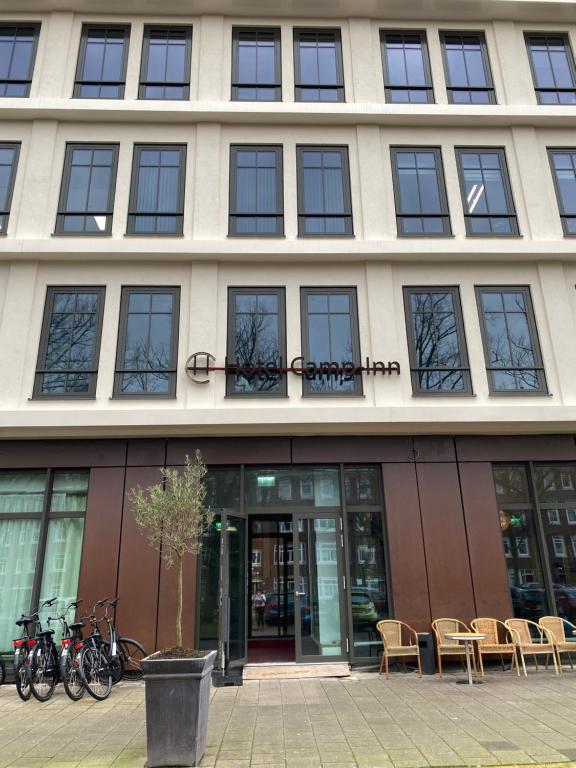 a building with bikes parked outside of it at CampIn Hotel in Amsterdam