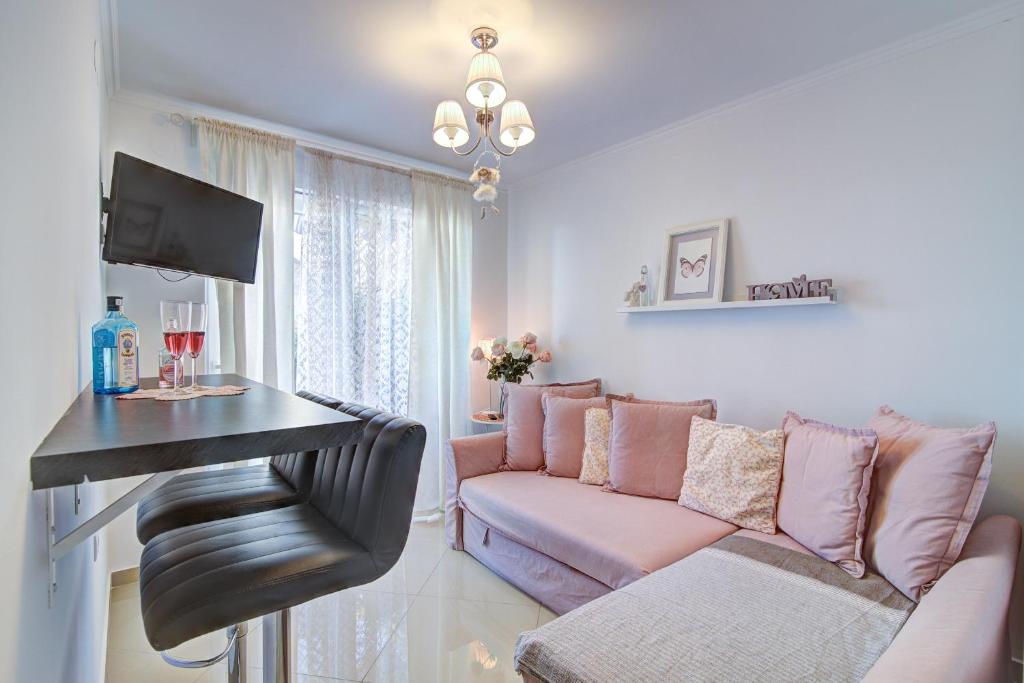 a living room with a couch and a table at Dida moj in Senj