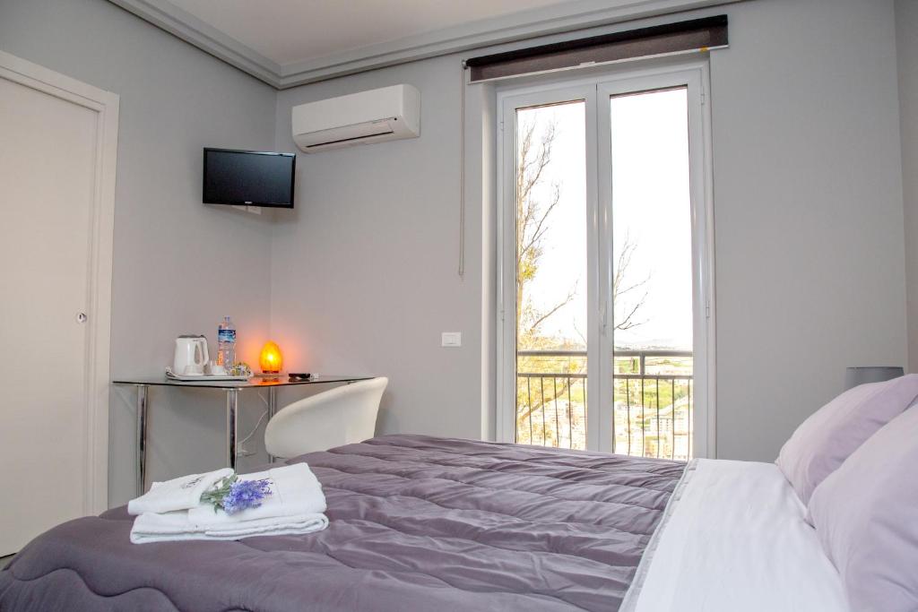 Posteľ alebo postele v izbe v ubytovaní Brio Bed & Breakfast