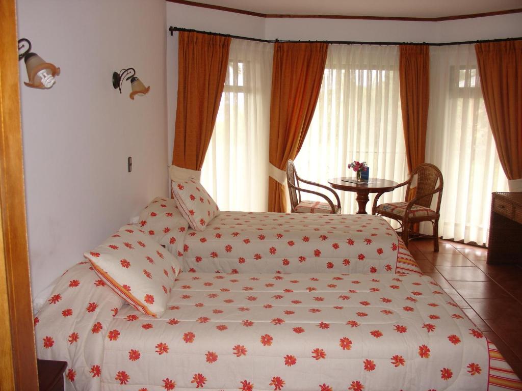 Postel nebo postele na pokoji v ubytování Hotel Victoria