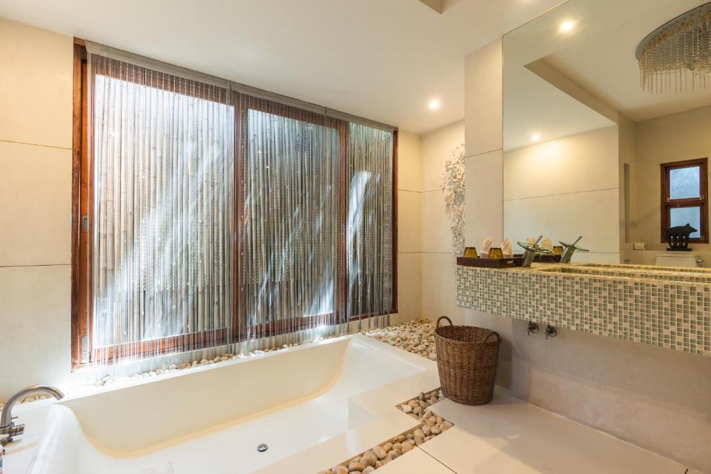 A bathroom at Tango Luxe Beach Villa, Koh Samui - SHA Extra Plus