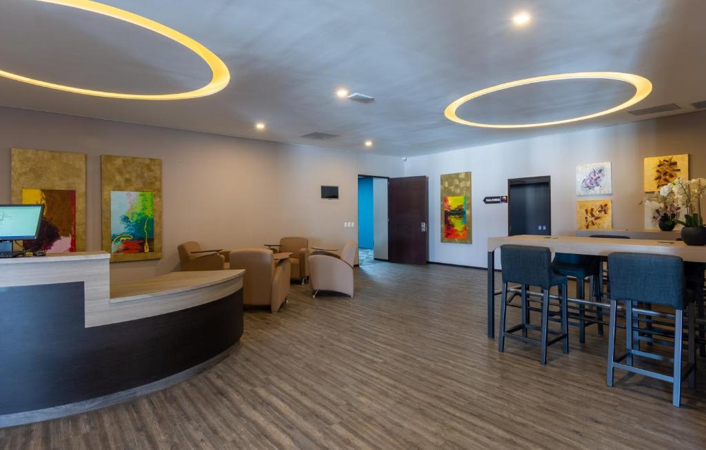 TV a/nebo společenská místnost v ubytování Hotel Glow Point - Mulza