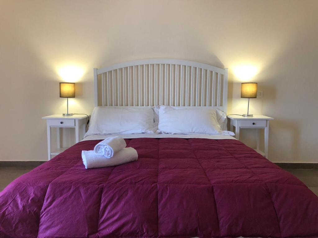 A bed or beds in a room at Lettera Living Penthouse