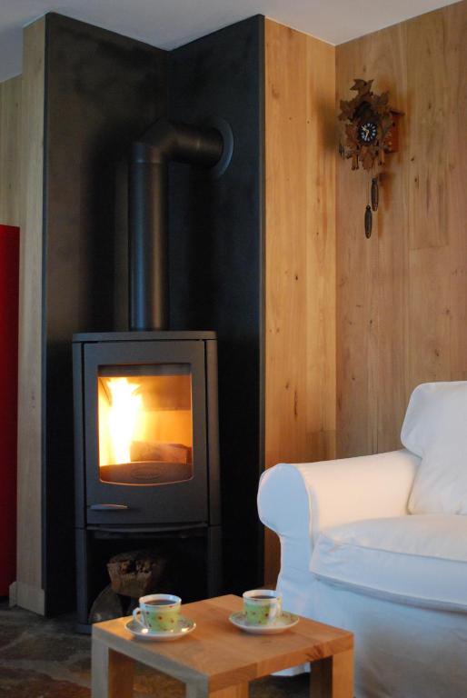 Posezení v ubytování Le Chalet à Bonnerue