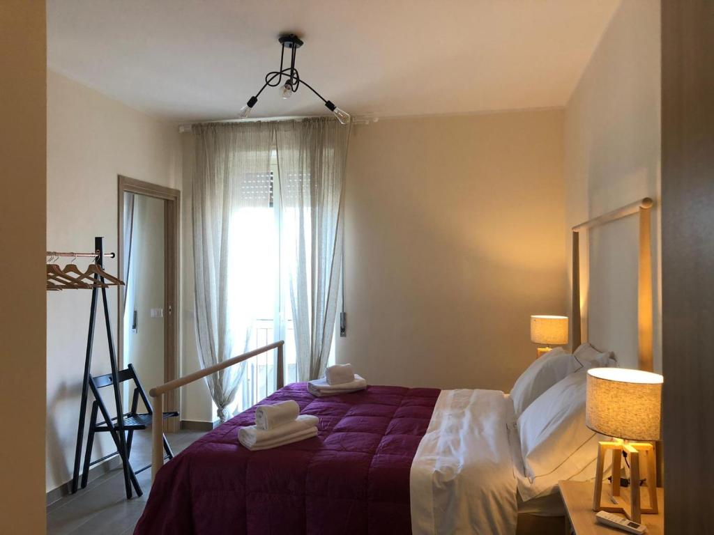 A bed or beds in a room at Lettera Living Penthouse
