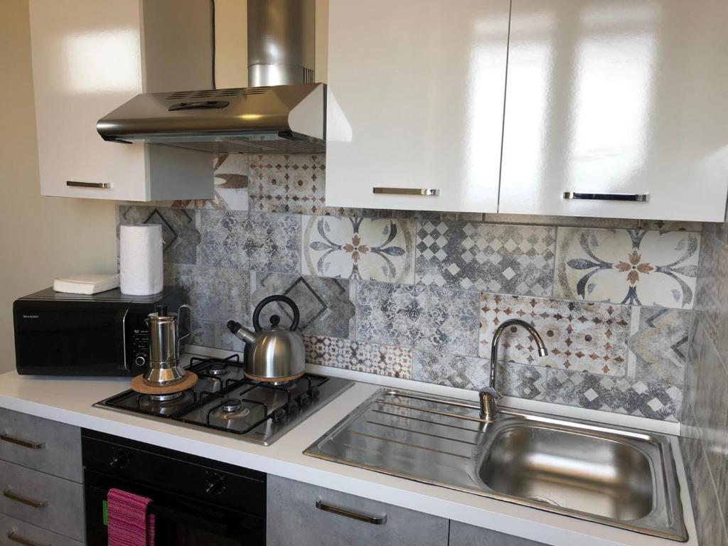 A kitchen or kitchenette at Lettera Living Penthouse