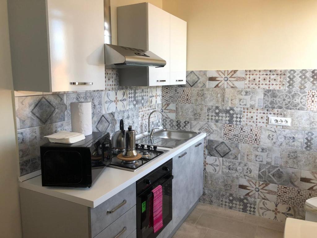 A kitchen or kitchenette at Lettera Living Penthouse
