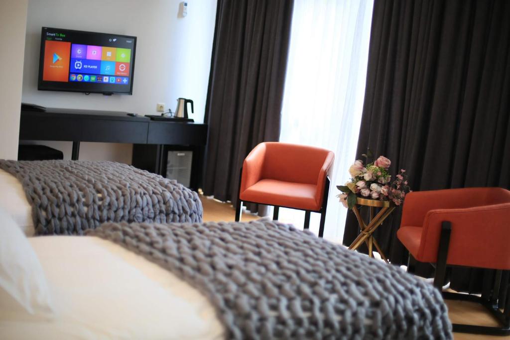 TV a/nebo společenská místnost v ubytování OTAKHEBI