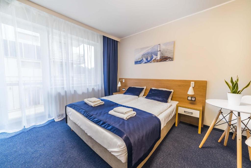 Postel nebo postele na pokoji v ubytování Navii