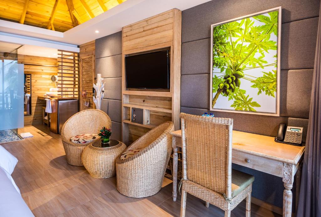 TV a/nebo společenská místnost v ubytování Hotel Isla del Encanto