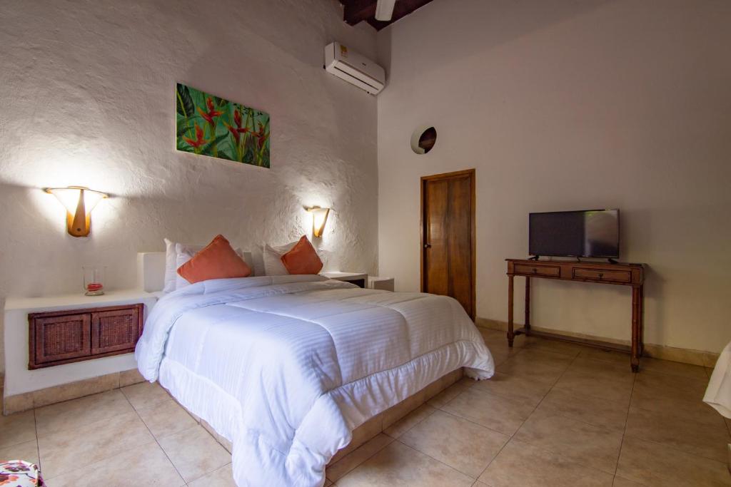 Postel nebo postele na pokoji v ubytování Casa Del Tejadillo