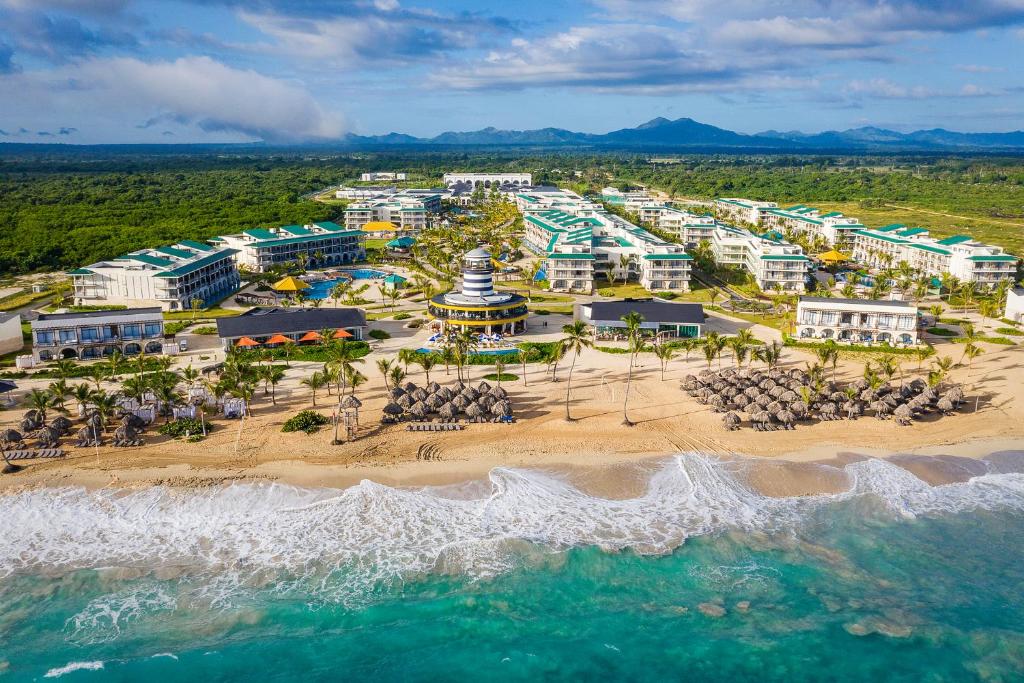 an aerial view of a resort on the beach at Ocean el Faro Resort - All Inclusive in Punta Cana