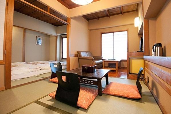 Postel nebo postele na pokoji v ubytování Hotel Edoya
