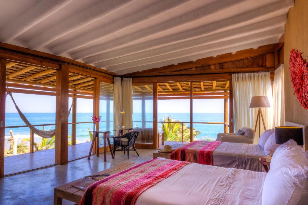 Postel nebo postele na pokoji v ubytování Adobe Villas