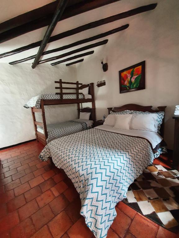 Postel nebo postele na pokoji v ubytování Hotel Quinta de Santa Ana