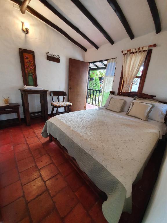Postel nebo postele na pokoji v ubytování Hotel Quinta de Santa Ana