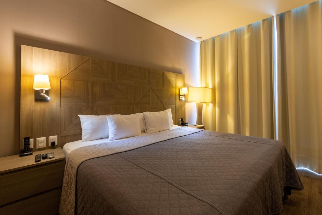 Postel nebo postele na pokoji v ubytování Hotel Glow Point - Mulza