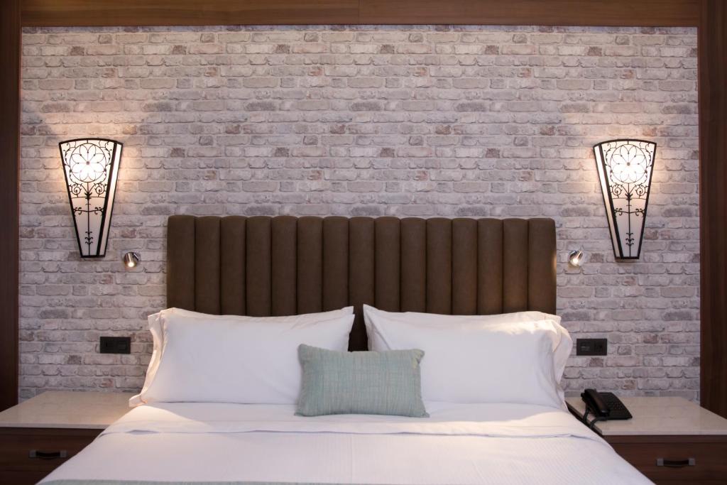 Postel nebo postele na pokoji v ubytování Hotel Ronda Minerva