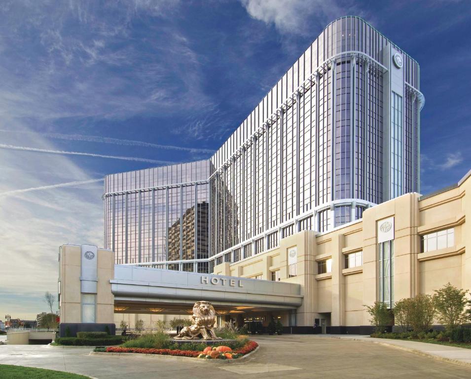 a hotel building with a lion statue in front of it at MGM Grand Detroit in Detroit