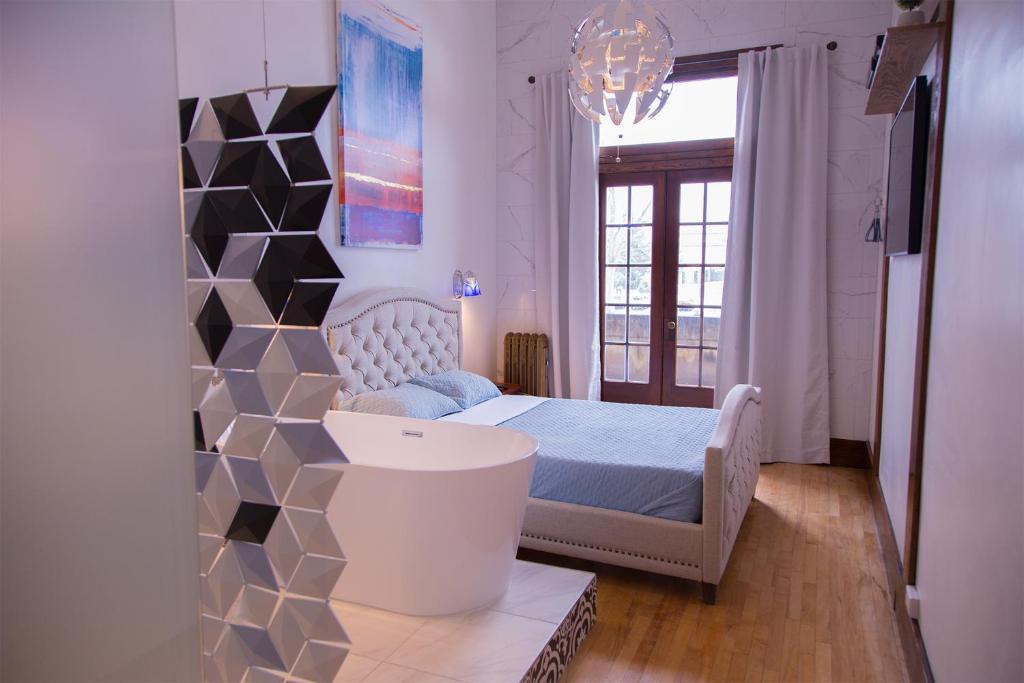 Postel nebo postele na pokoji v ubytování School 31 Lofts