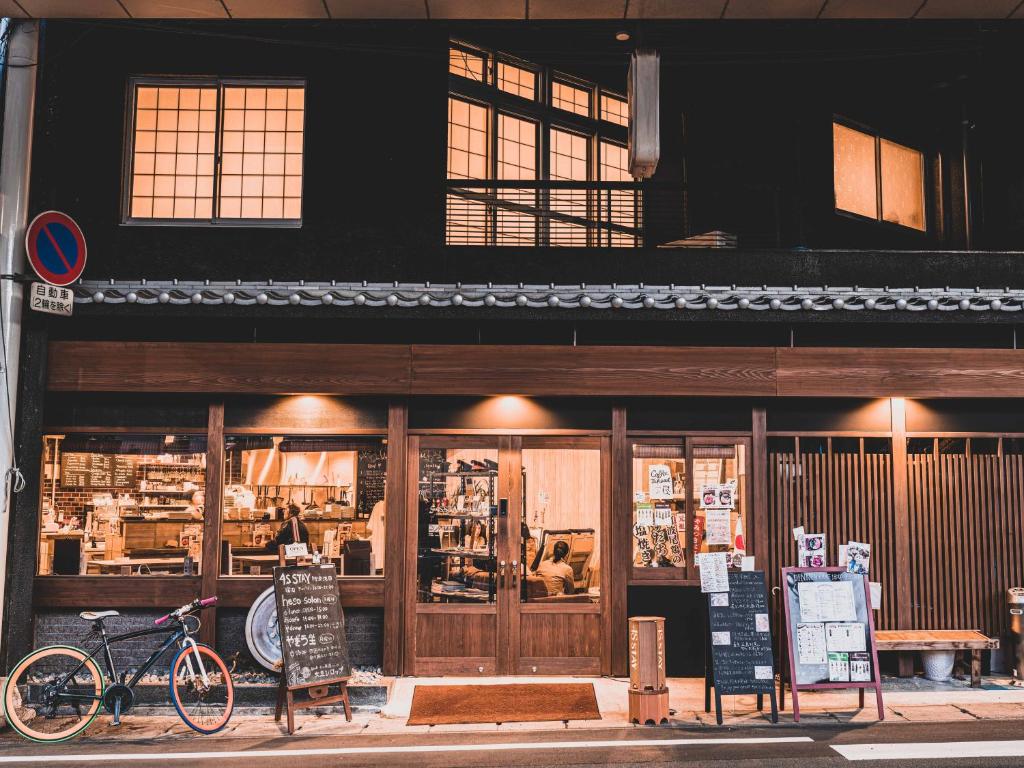 a store front with bicycles parked in front of it at 4S STAY Awaikeda Ekimae in Miyoshi