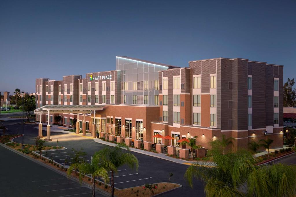 a rendering of a hotel with a parking lot at Hyatt Place Vacaville in Vacaville