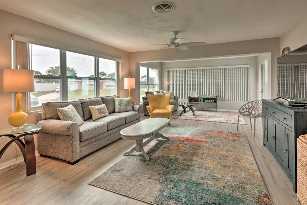 A seating area at Bright Bungalow with Porch Walk to Ormond Beach!