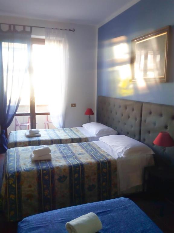 Postel nebo postele na pokoji v ubytování Bed and Breakfast Mimosa
