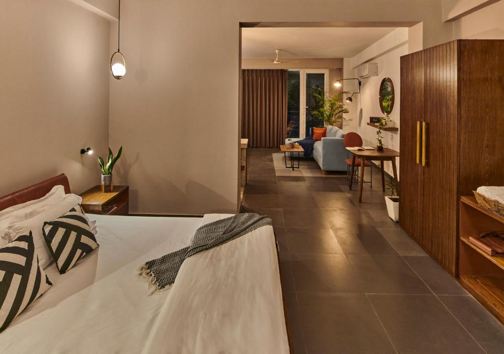 Postel nebo postele na pokoji v ubytování Minimalist Poshtel & Suites