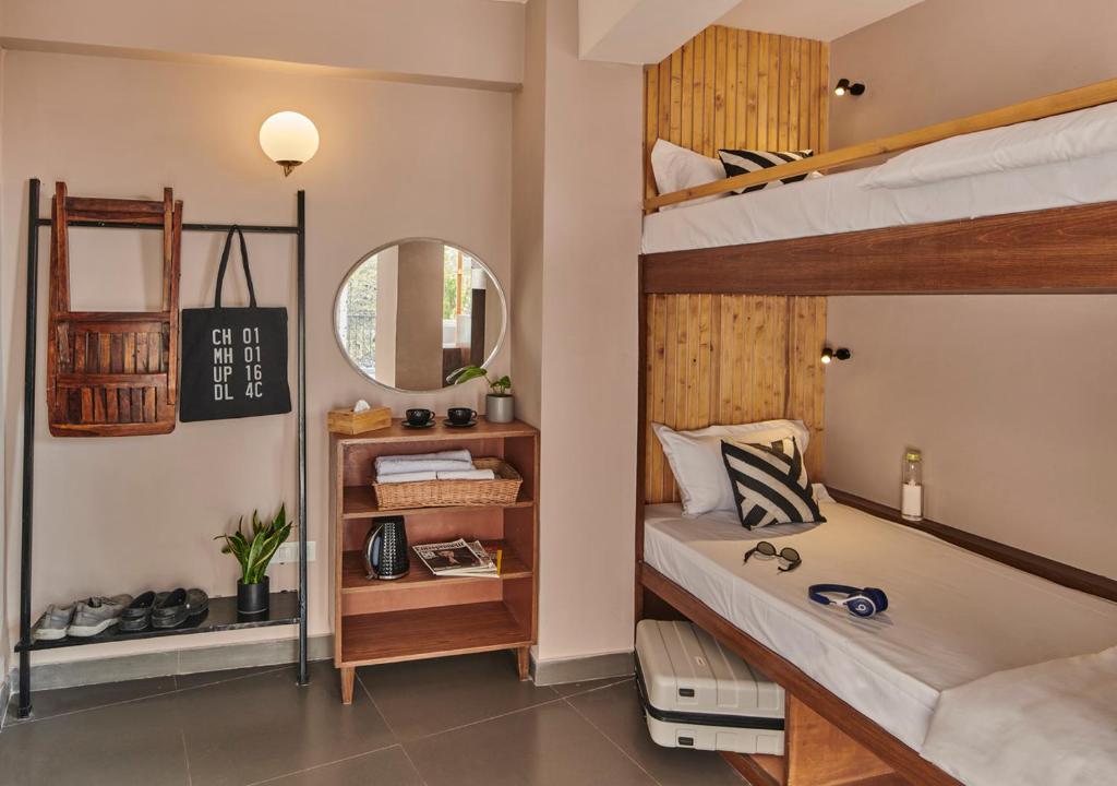 Postel nebo postele na pokoji v ubytování Minimalist Poshtel & Suites