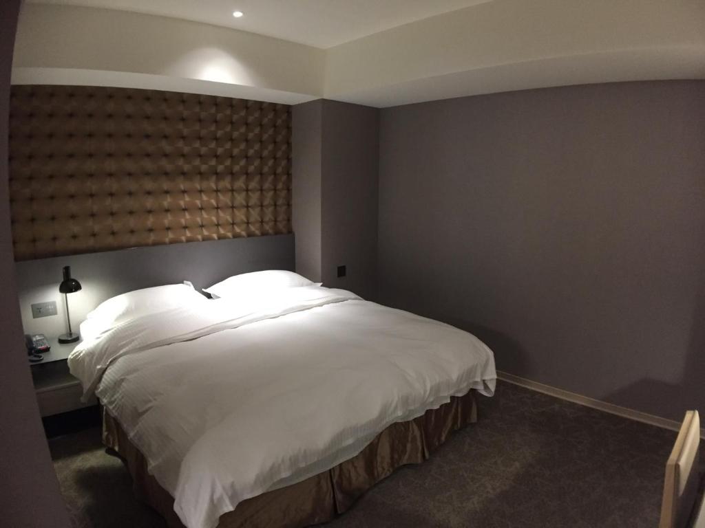 Postel nebo postele na pokoji v ubytování City Suites - Taoyuan Gateway