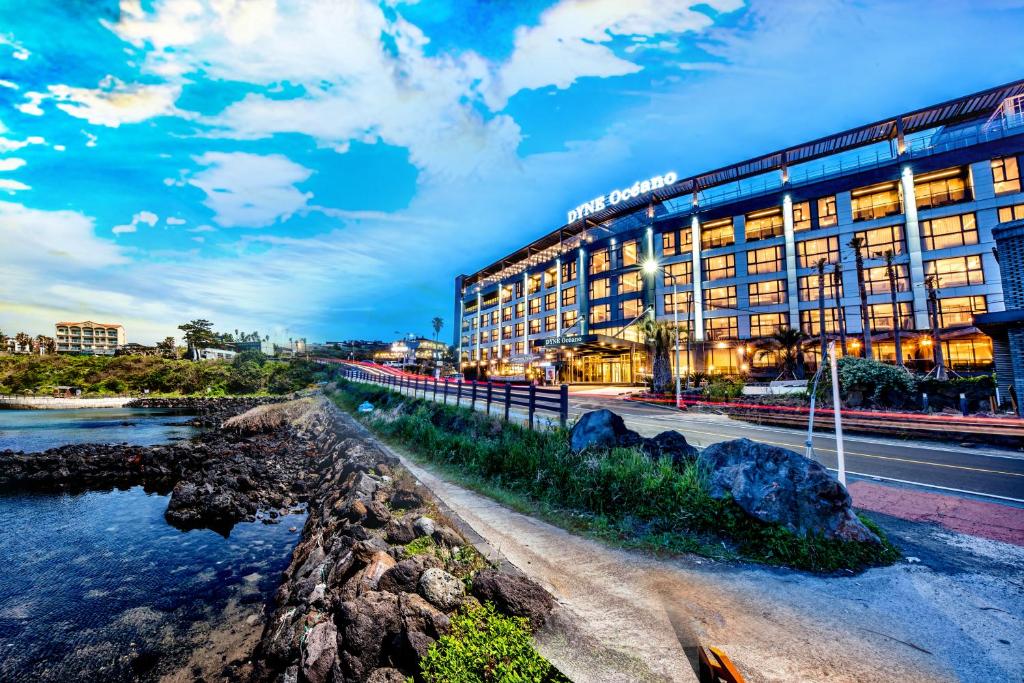 a rendering of a hotel with a river in front at Dyne Oceano Hotel in Jeju