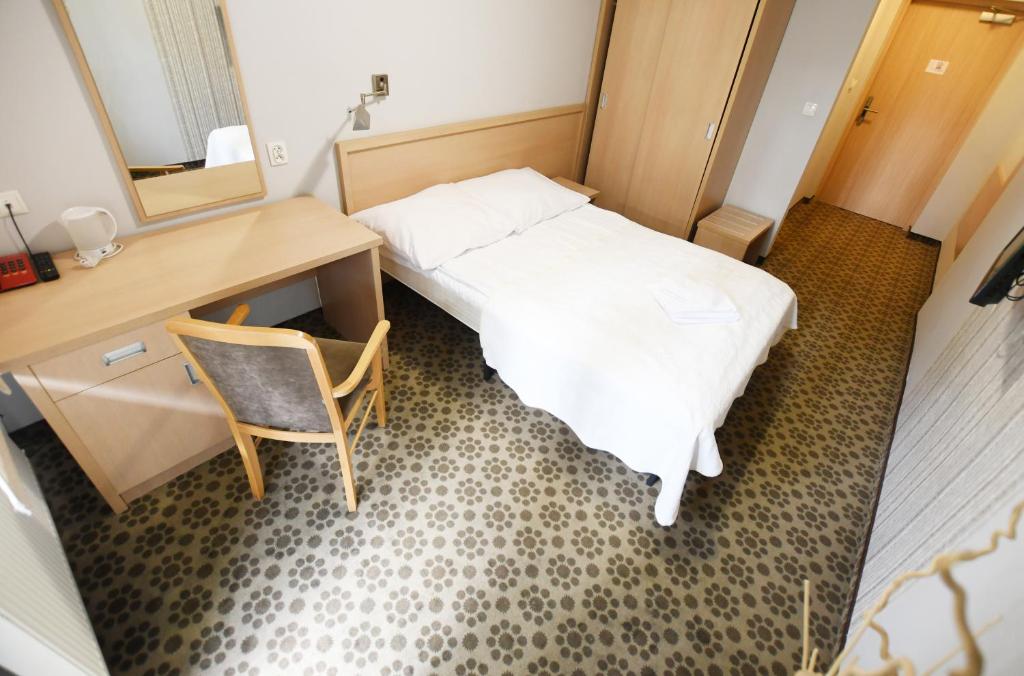Postel nebo postele na pokoji v ubytování Geovita Dźwirzyno