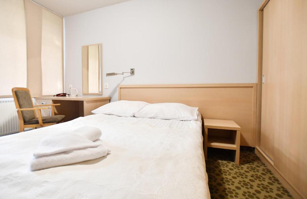 Postel nebo postele na pokoji v ubytování Geovita Dźwirzyno